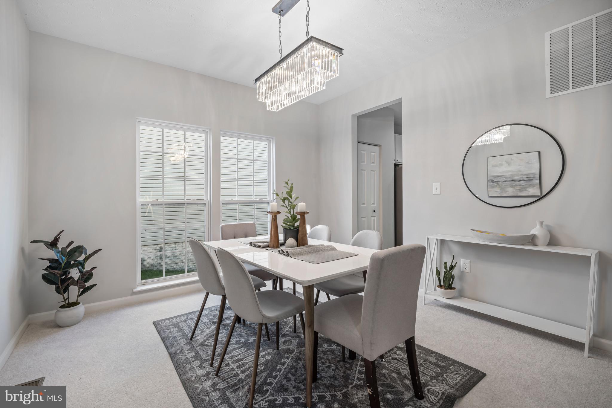 7739 Rotherham Drive Hanover, MD 21076 - Photo 7 of 39 Dining Room | Chandelier | Carpet.