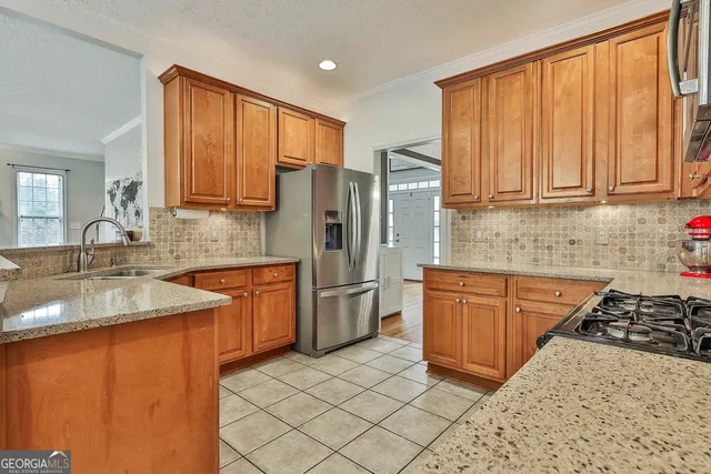 a bathroom with a granite countertop toilet a sink and a mirror