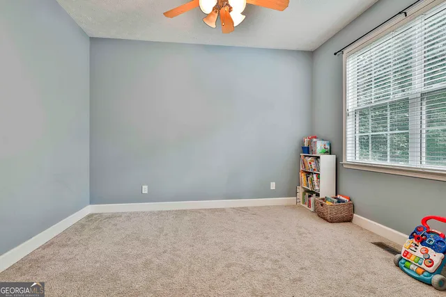 a bedroom with furniture and a chandelier