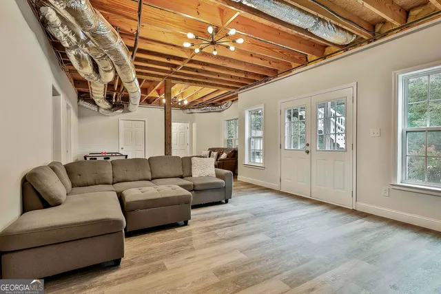 a bedroom with furniture and a chandelier