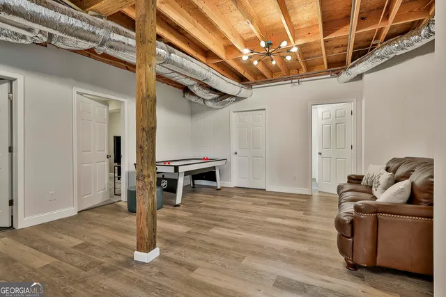 a view of walk in closet with racks on the wall