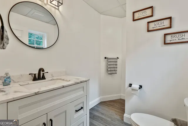 a view of a house with a backyard