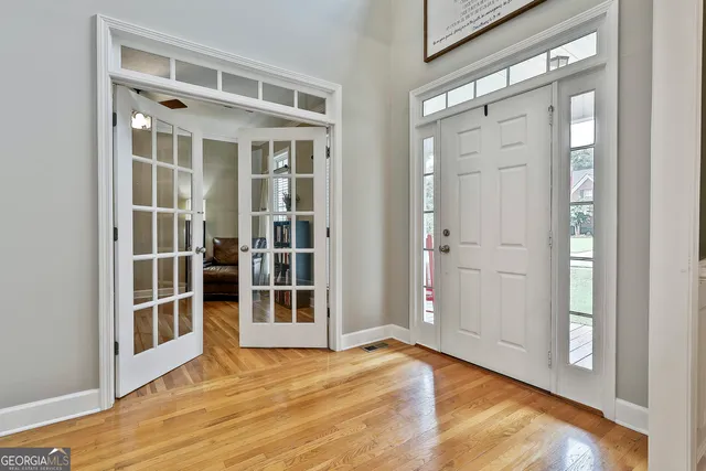 a bedroom with furniture and a book shelf