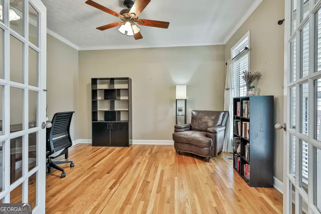 a view of a livingroom with furniture and a bookshelf