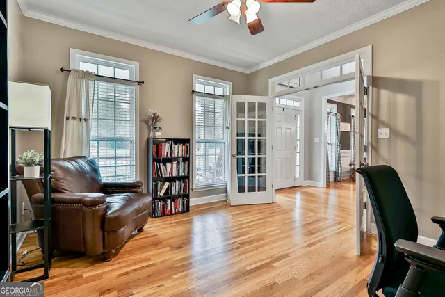 a view of a room with a furniture and chandelier