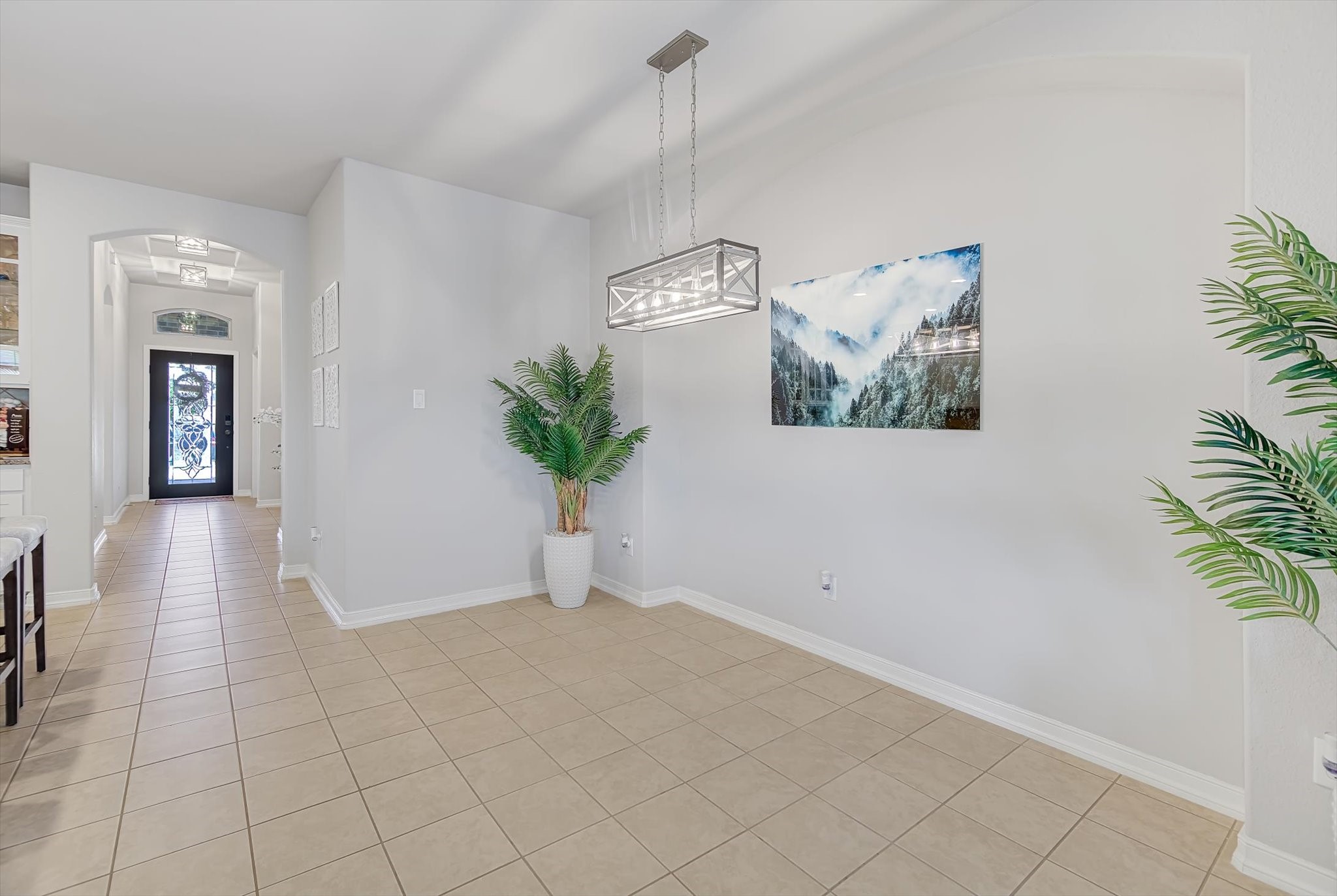 16514 Twinwalker Drive Houston, TX 77049 - Photo 12 of 35 a view of a hallway with a potted plant