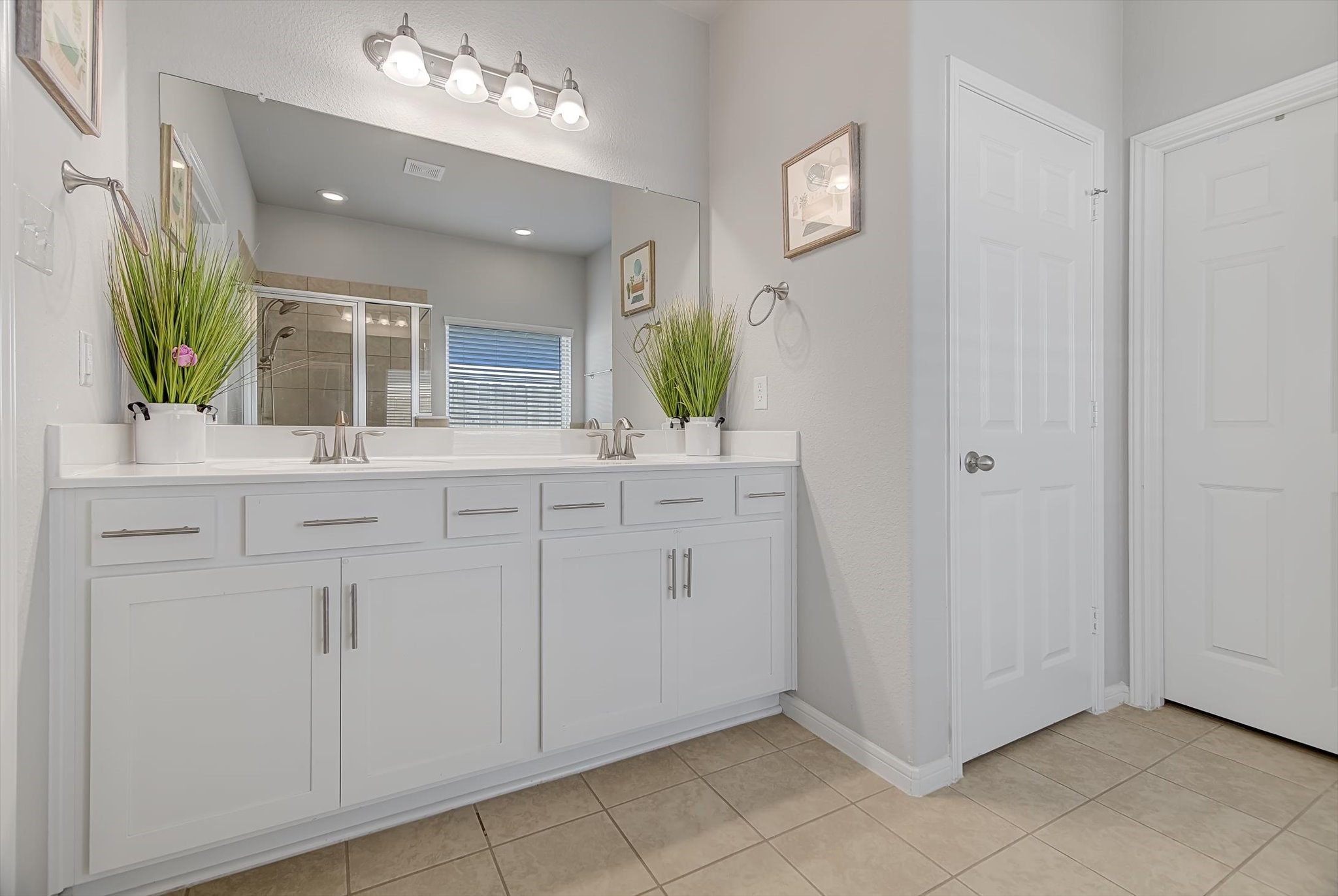16514 Twinwalker Drive Houston, TX 77049 - Photo 16 of 35 a bathroom with a sink vanity and a mirror