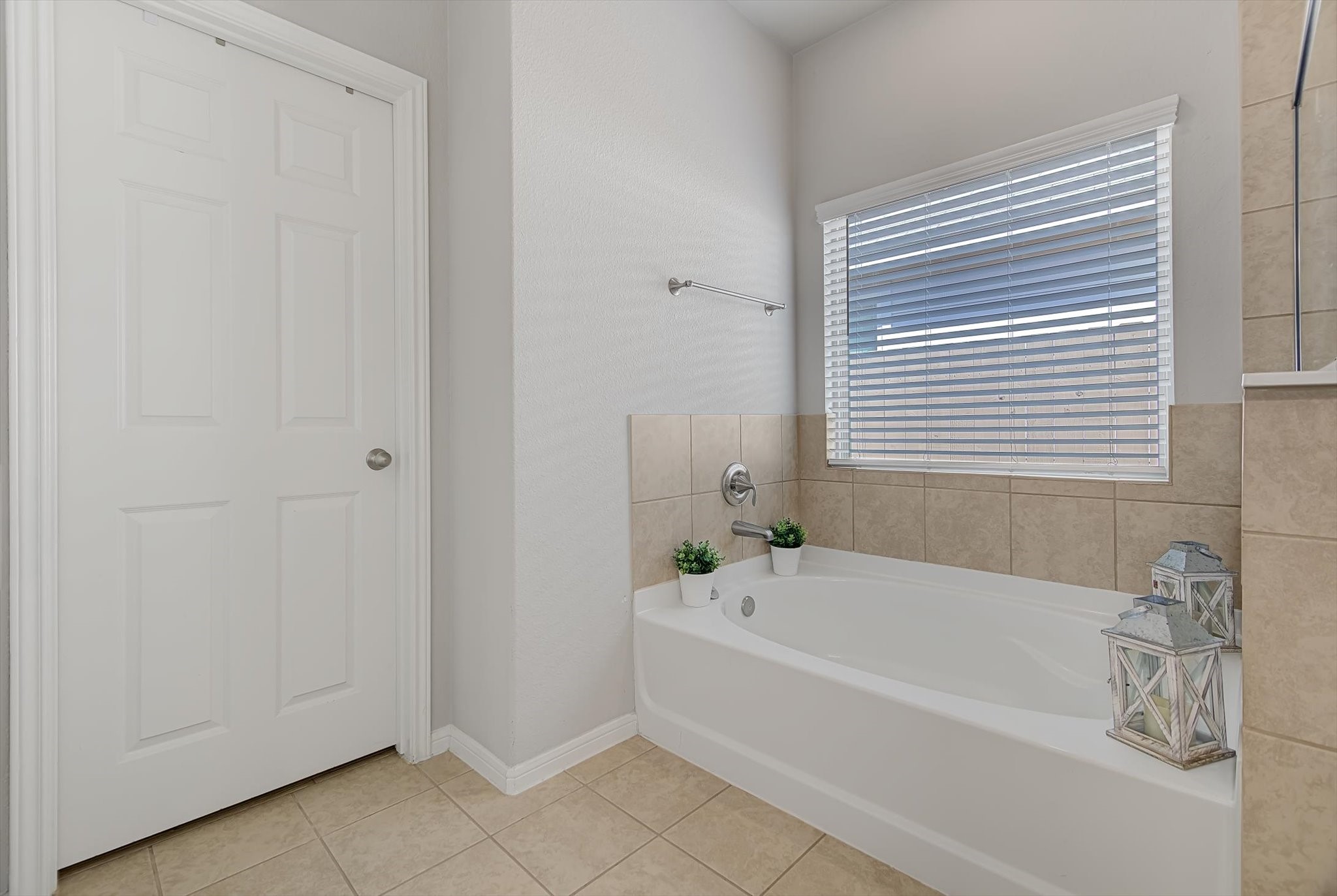 16514 Twinwalker Drive Houston, TX 77049 - Photo 18 of 35 a white bath tub sitting next to a window