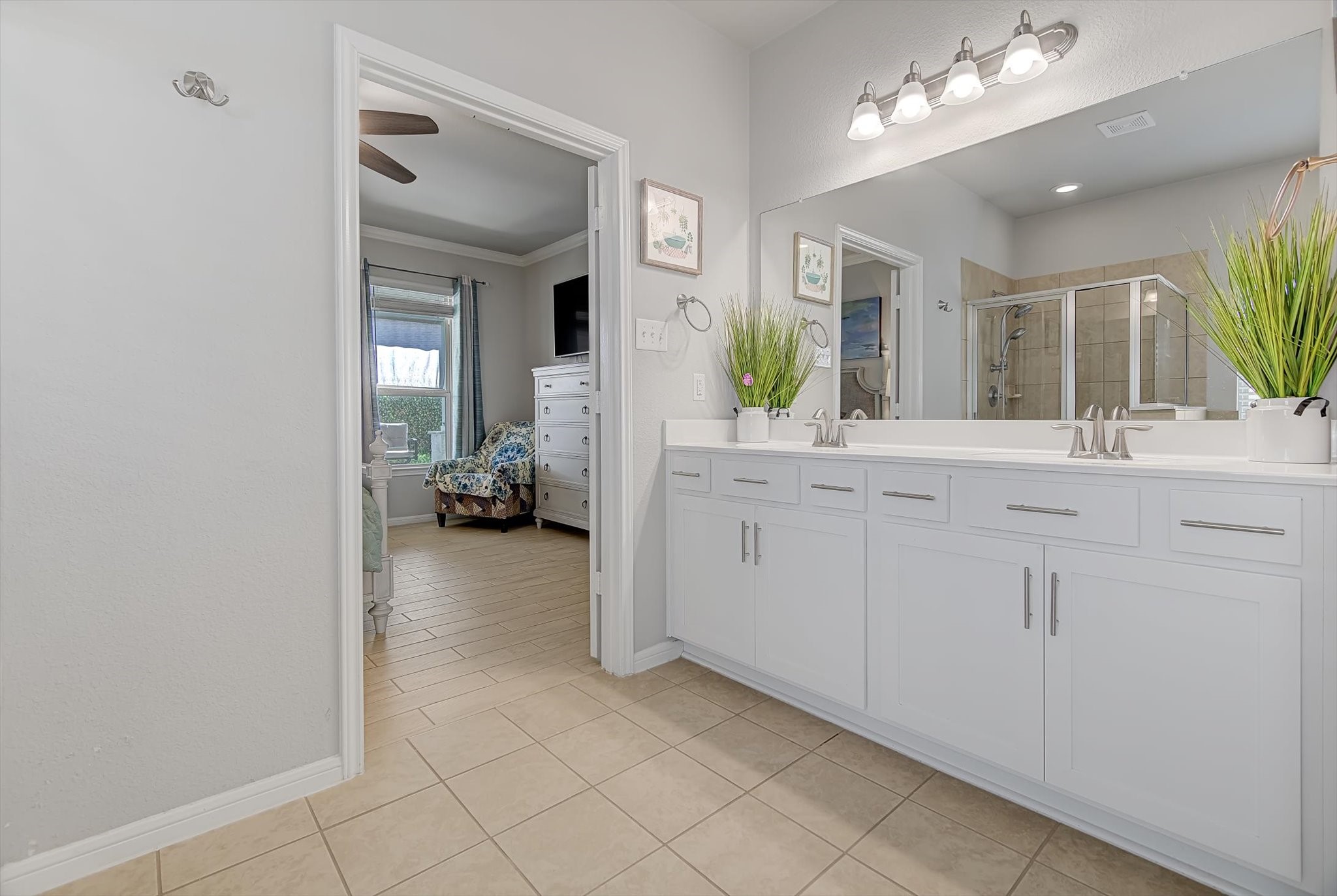 16514 Twinwalker Drive Houston, TX 77049 - Photo 19 of 35 a en suite bathroom with a sink mirror and vanity
