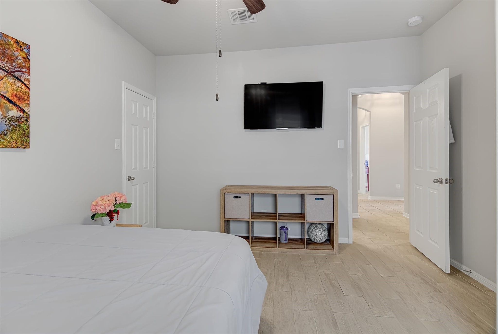 16514 Twinwalker Drive Houston, TX 77049 - Photo 23 of 35 a bedroom with a bed and flat screen tv