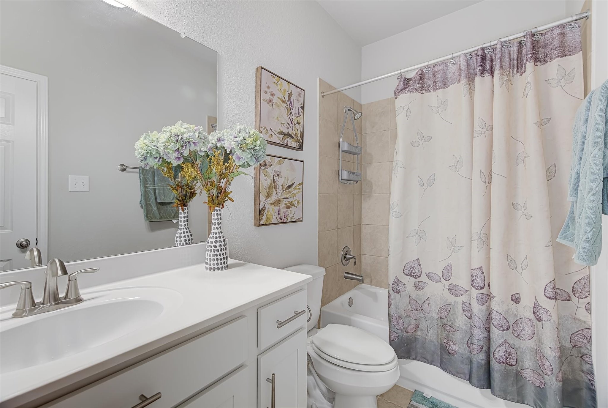 16514 Twinwalker Drive Houston, TX 77049 - Photo 27 of 35 a bathroom with a granite countertop sink a toilet and a mirror