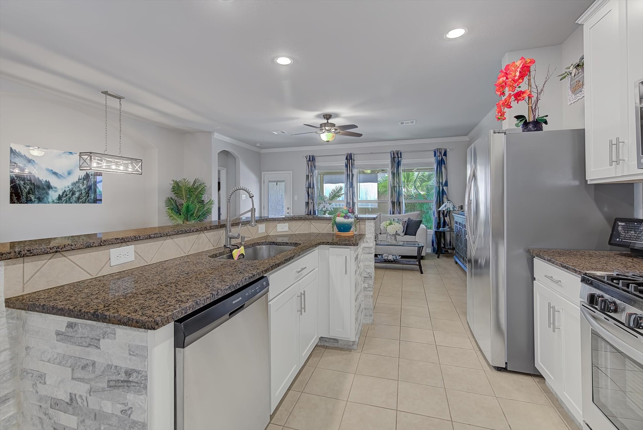 16514 Twinwalker Drive Houston, TX 77049 - Photo 7 of 35 a kitchen with granite countertop a sink stainless steel appliances and cabinets