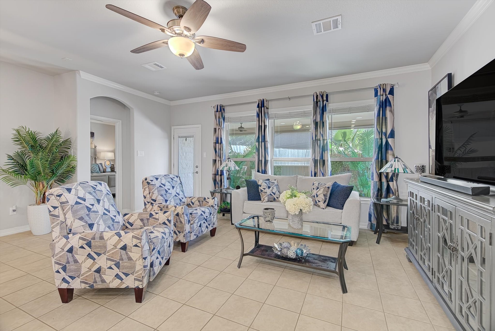 16514 Twinwalker Drive Houston, TX 77049 - Photo 9 of 35 a living room with furniture and a flat screen tv