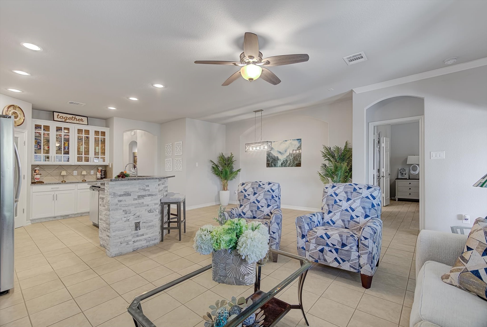 16514 Twinwalker Drive Houston, TX 77049 - Photo 10 of 35 a living room with furniture and a chandelier