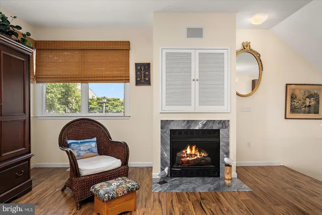 a kitchen with stainless steel appliances granite countertop a sink dishwasher stove and cabinets with wooden floor