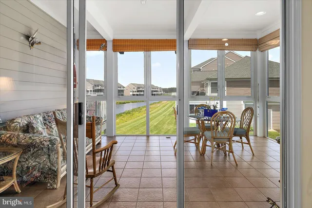 a kitchen with stainless steel appliances granite countertop a refrigerator a stove a sink and a microwave