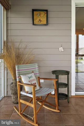 a kitchen with stainless steel appliances kitchen island granite countertop a stove top oven a sink dishwasher a dining table and chairs with wooden floor