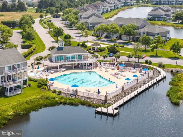 a view of a house with a yard and a large pool