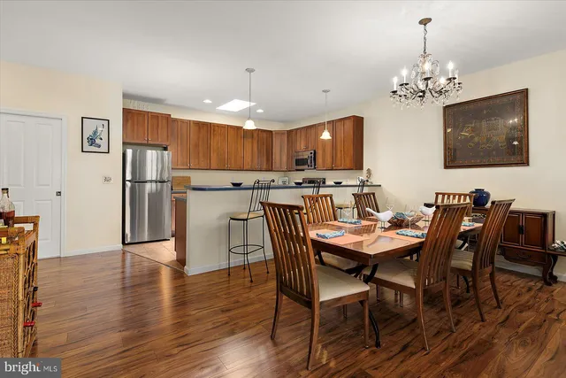 a bedroom with bed and a large window