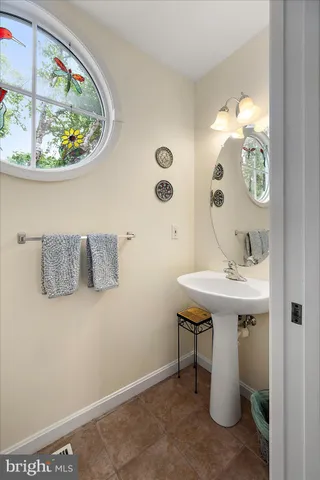 a bedroom with bed and a chandelier