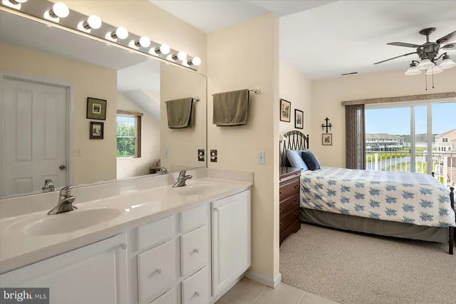 a view of residential houses with swimming pool and lake view