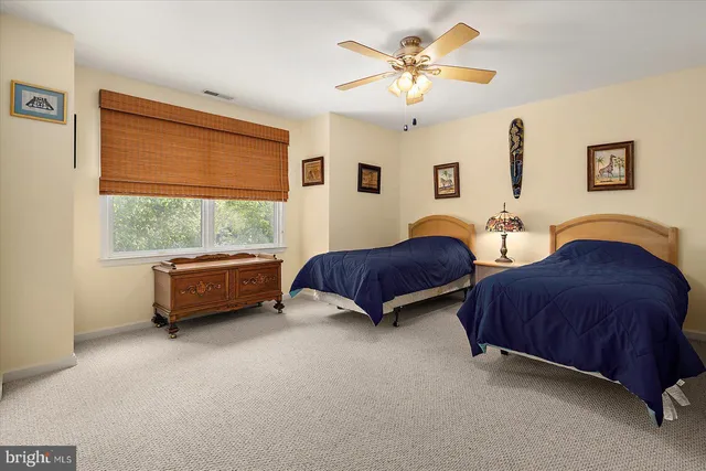 a view of an apartment building with a yard