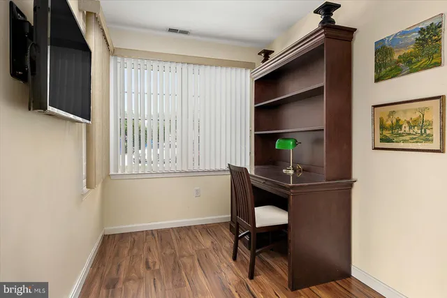 an aerial view of residential building and lake