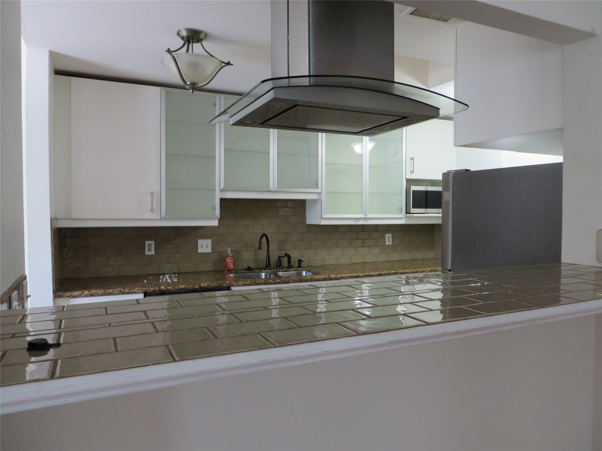 2815 Old Fort Road Sugar Land, TX 77479 - Photo 6 of 12 From the breakfast bar there is another view of the kitchen.