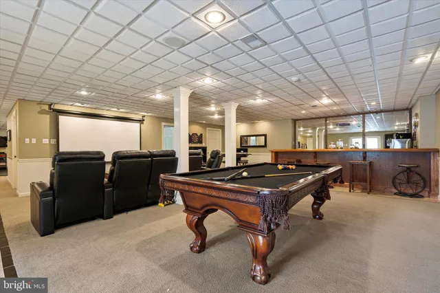 a room with lots of furniture and air hockey table