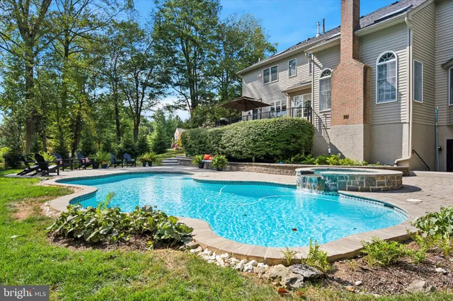 a view of a swimming pool with a patio