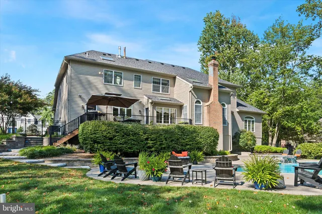 a front view of house with a garden