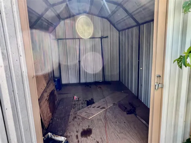 a view of stairs and wooden floor