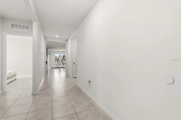 a hallway with wooden floor