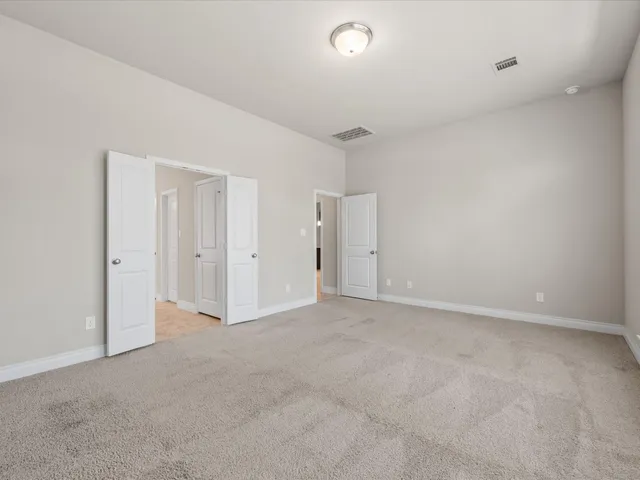 a bathroom with a shower and a sink