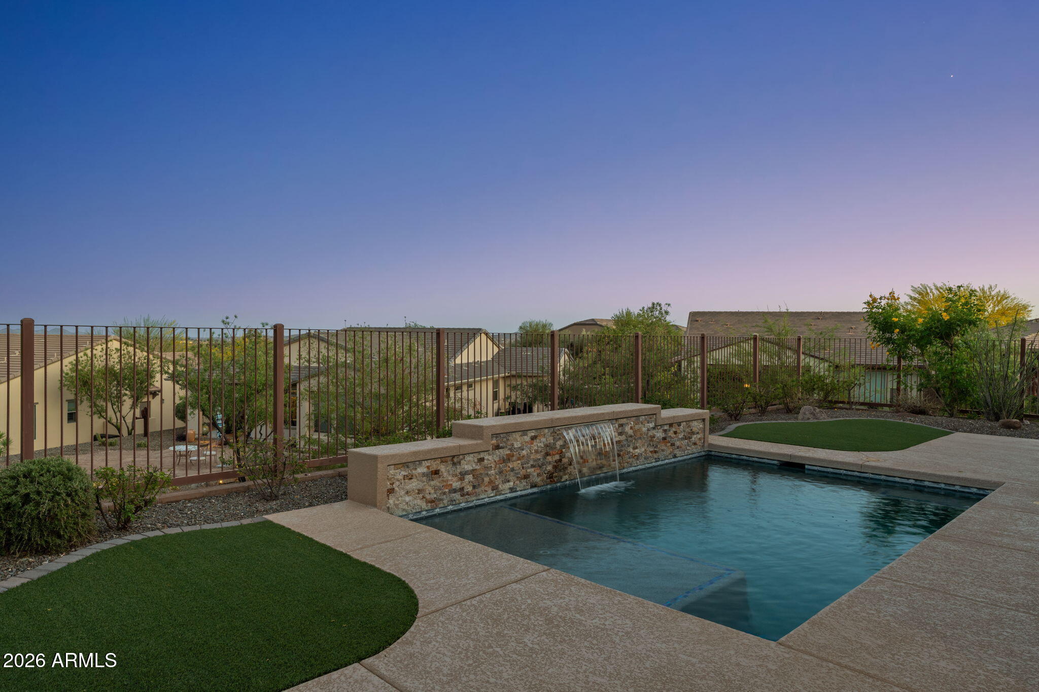 3675 Gold Ridge Road Wickenburg, AZ 85390 - Photo 45 of 58 a view of a lake with a house in the background