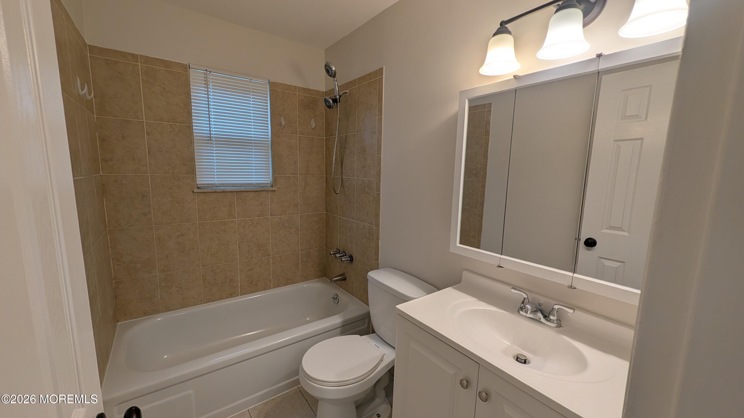 230 Sawmill Road, Unit A Brick, NJ 08724 - Photo 13 of 21 a bathroom with a sink a toilet and shower