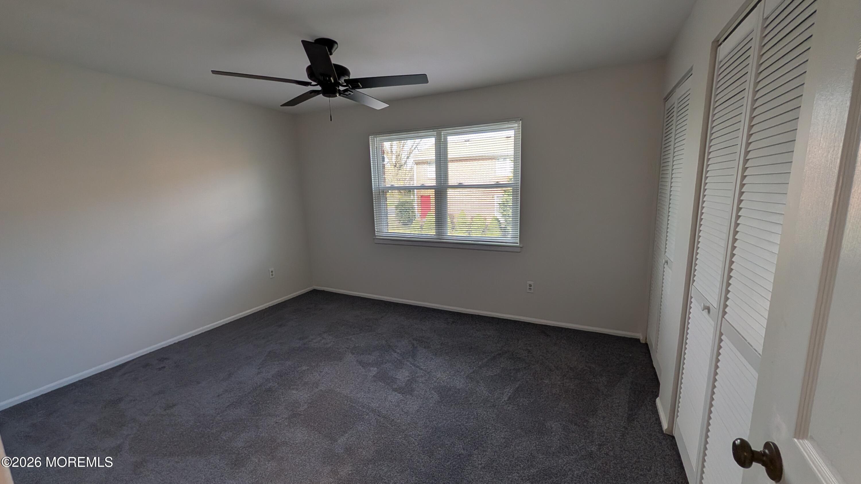 230 Sawmill Road, Unit A Brick, NJ 08724 - Photo 15 of 21 a view of a livingroom with a ceiling fan and window