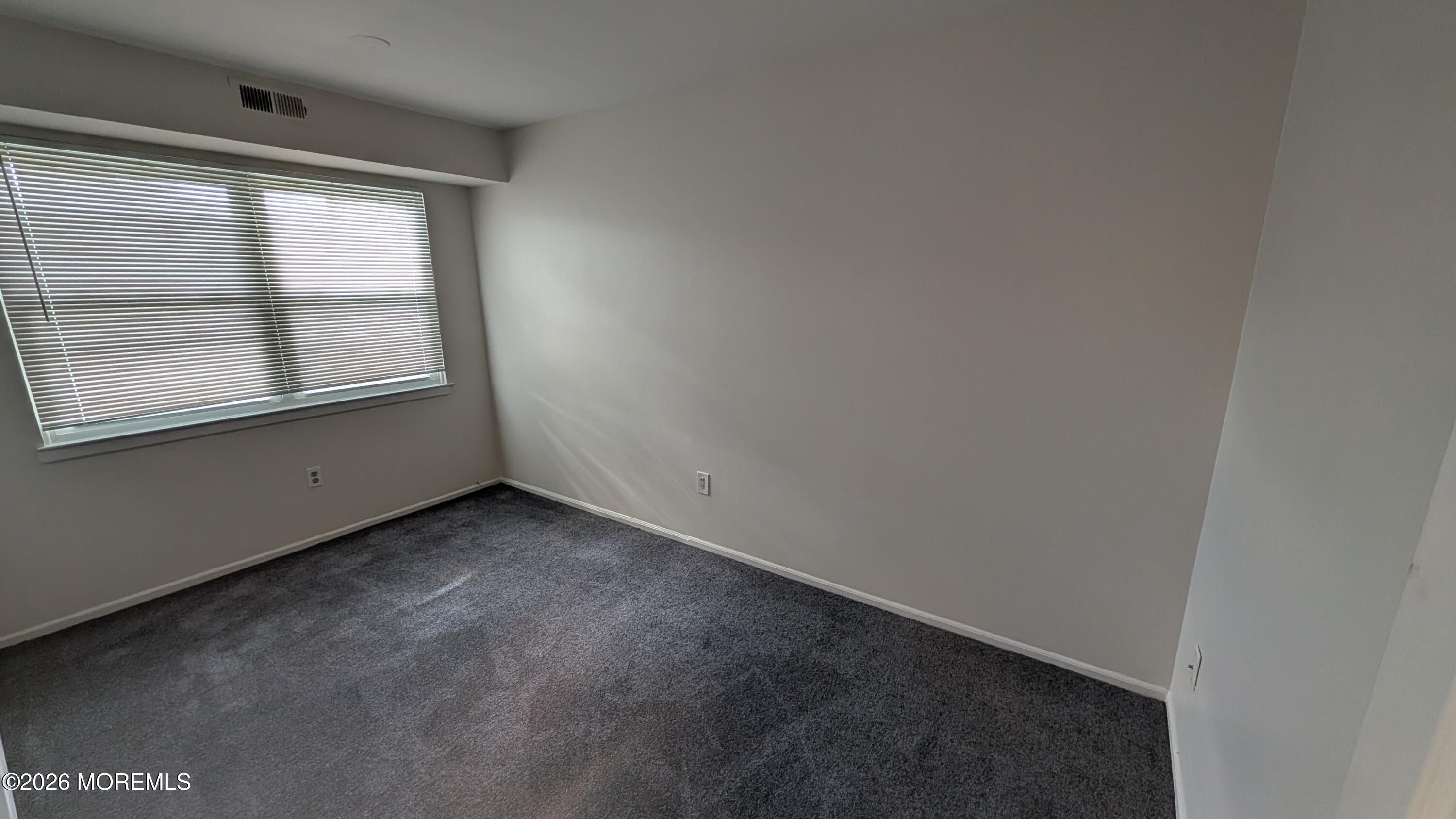 230 Sawmill Road, Unit A Brick, NJ 08724 - Photo 18 of 21 an empty room with a window