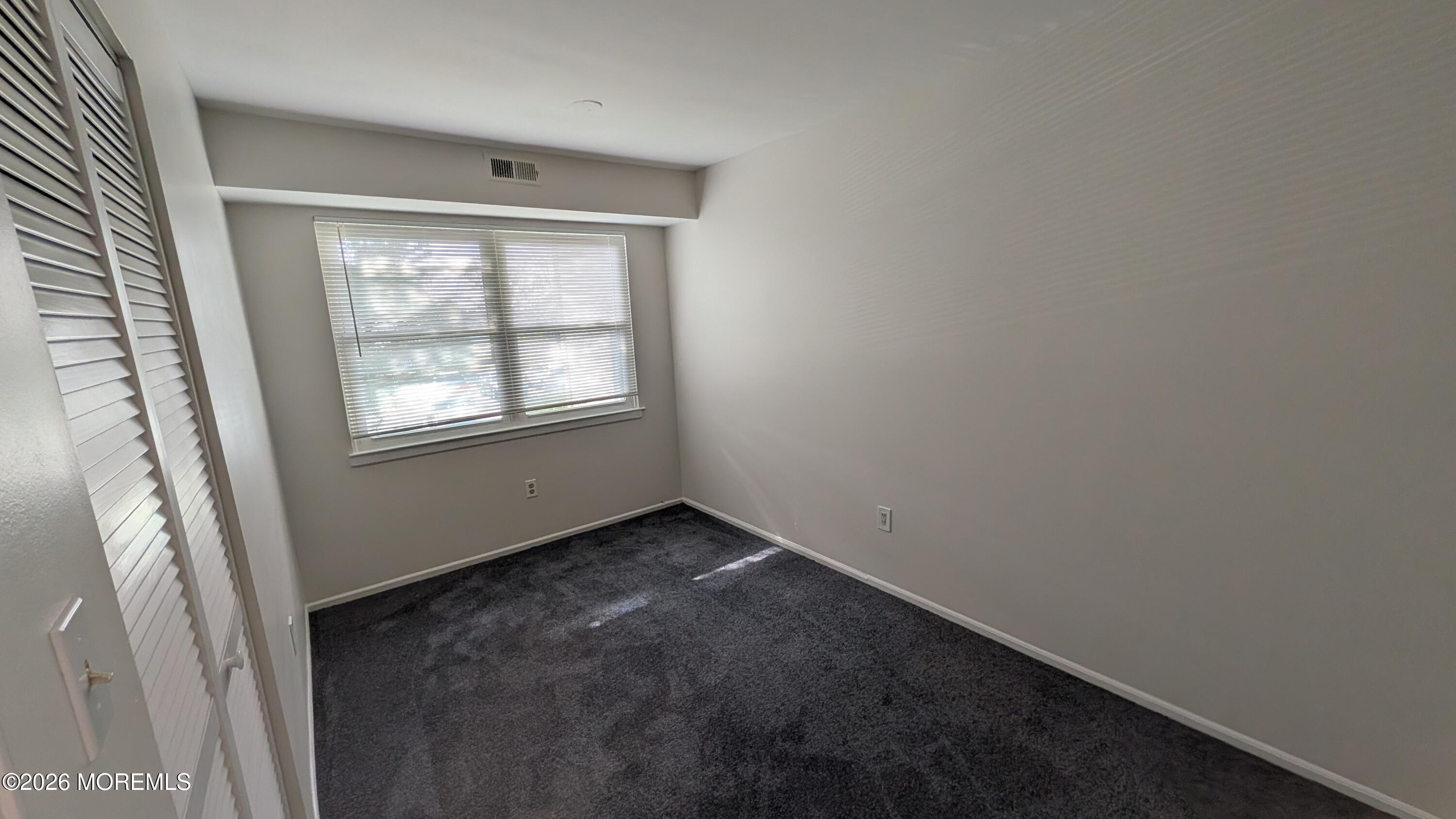 230 Sawmill Road, Unit A Brick, NJ 08724 - Photo 20 of 21 an empty room with windows