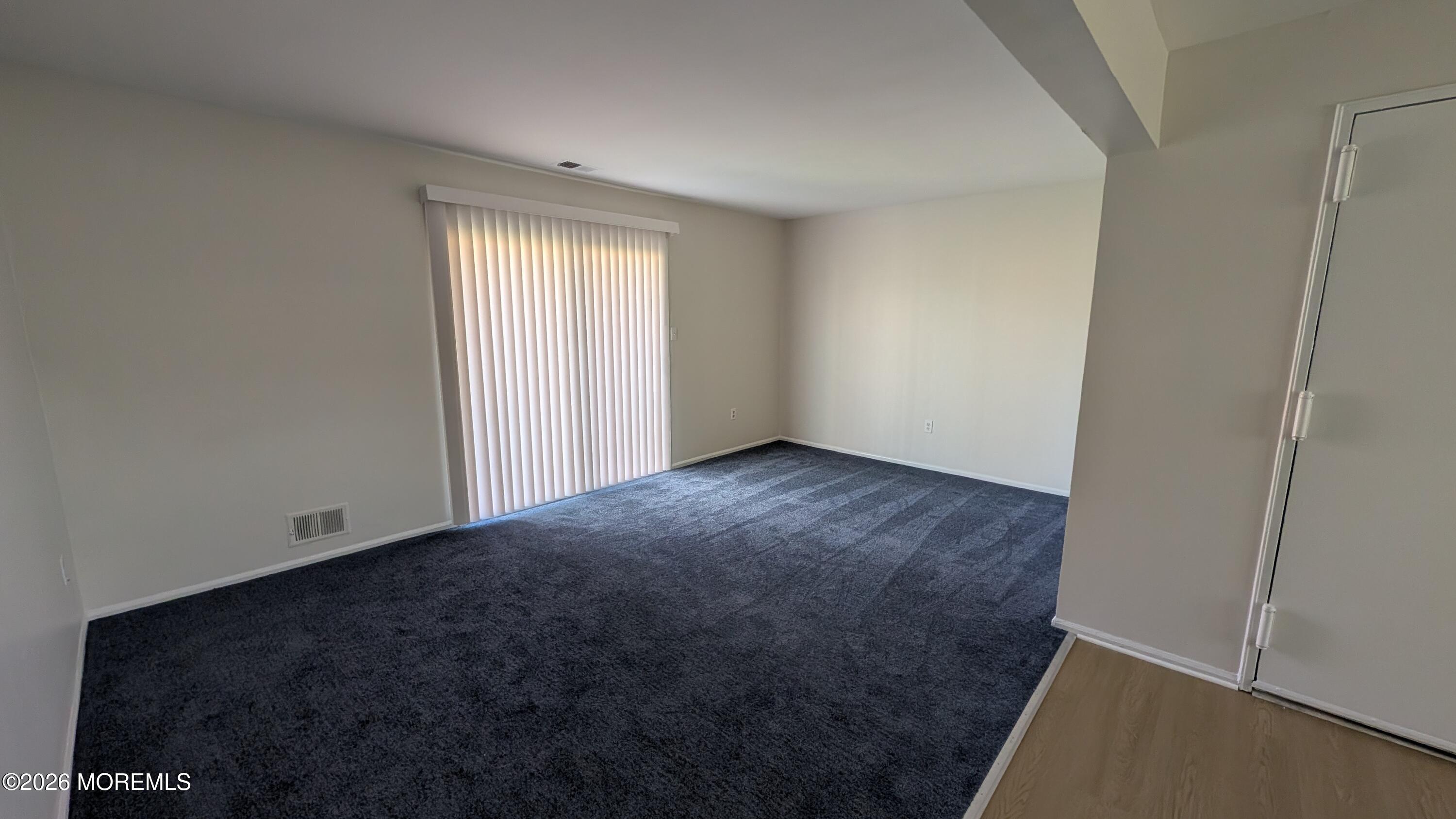 230 Sawmill Road, Unit A Brick, NJ 08724 - Photo 8 of 21 an empty room with windows