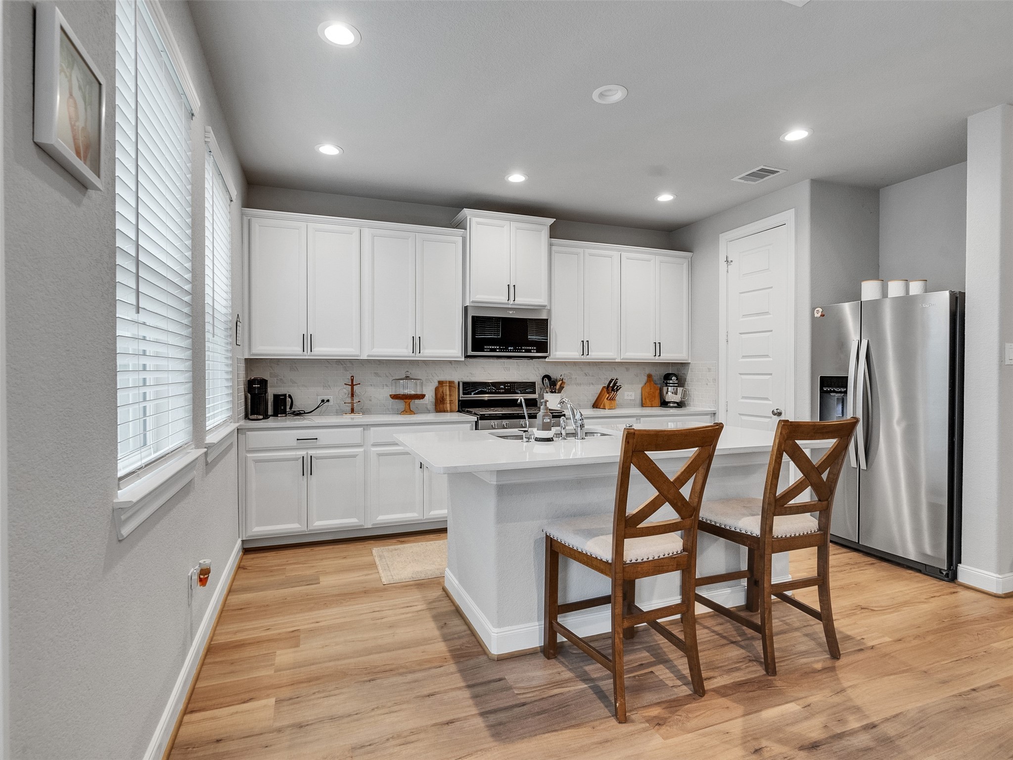 3118 Cloud Forest Lane Houston, TX 77080 - Photo 11 of 40 a kitchen with stainless steel appliances granite countertop a refrigerator and microwave