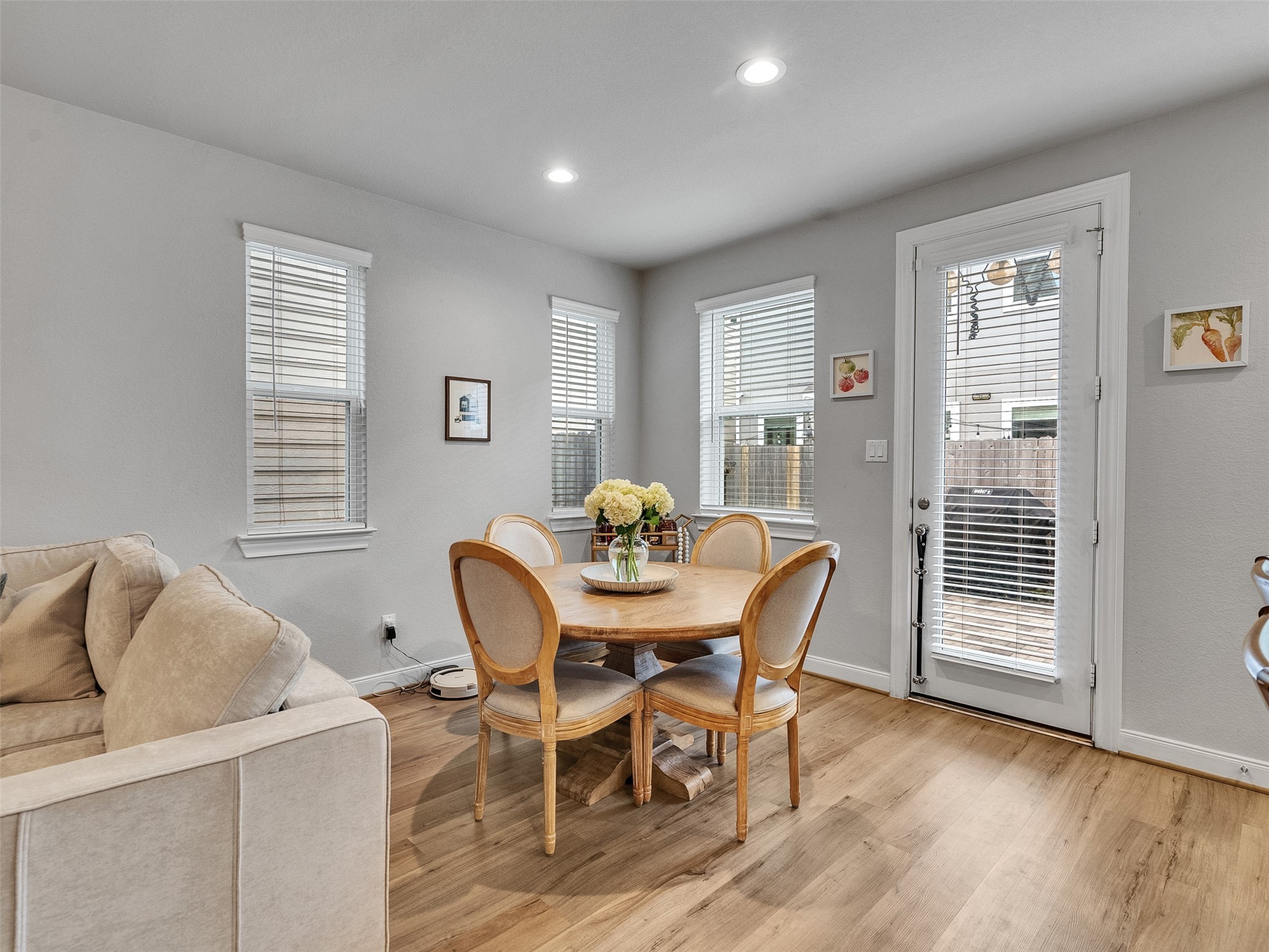 3118 Cloud Forest Lane Houston, TX 77080 - Photo 14 of 40 a view of a dining room with furniture and wooden floor