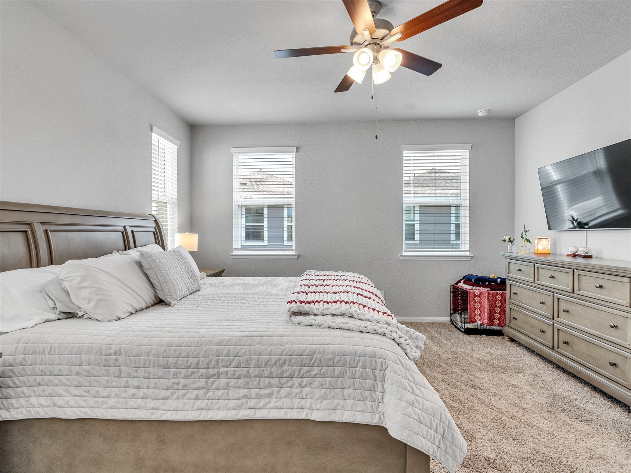 3118 Cloud Forest Lane Houston, TX 77080 - Photo 23 of 40 a bedroom with a large bed and flat tv