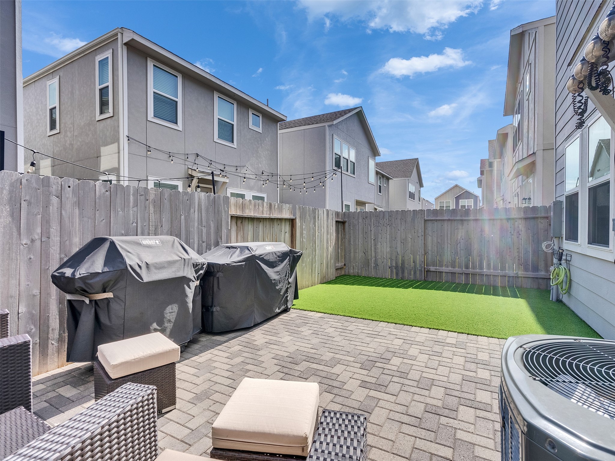 3118 Cloud Forest Lane Houston, TX 77080 - Photo 34 of 40 a view of a patio with couches chairs and a fire pit