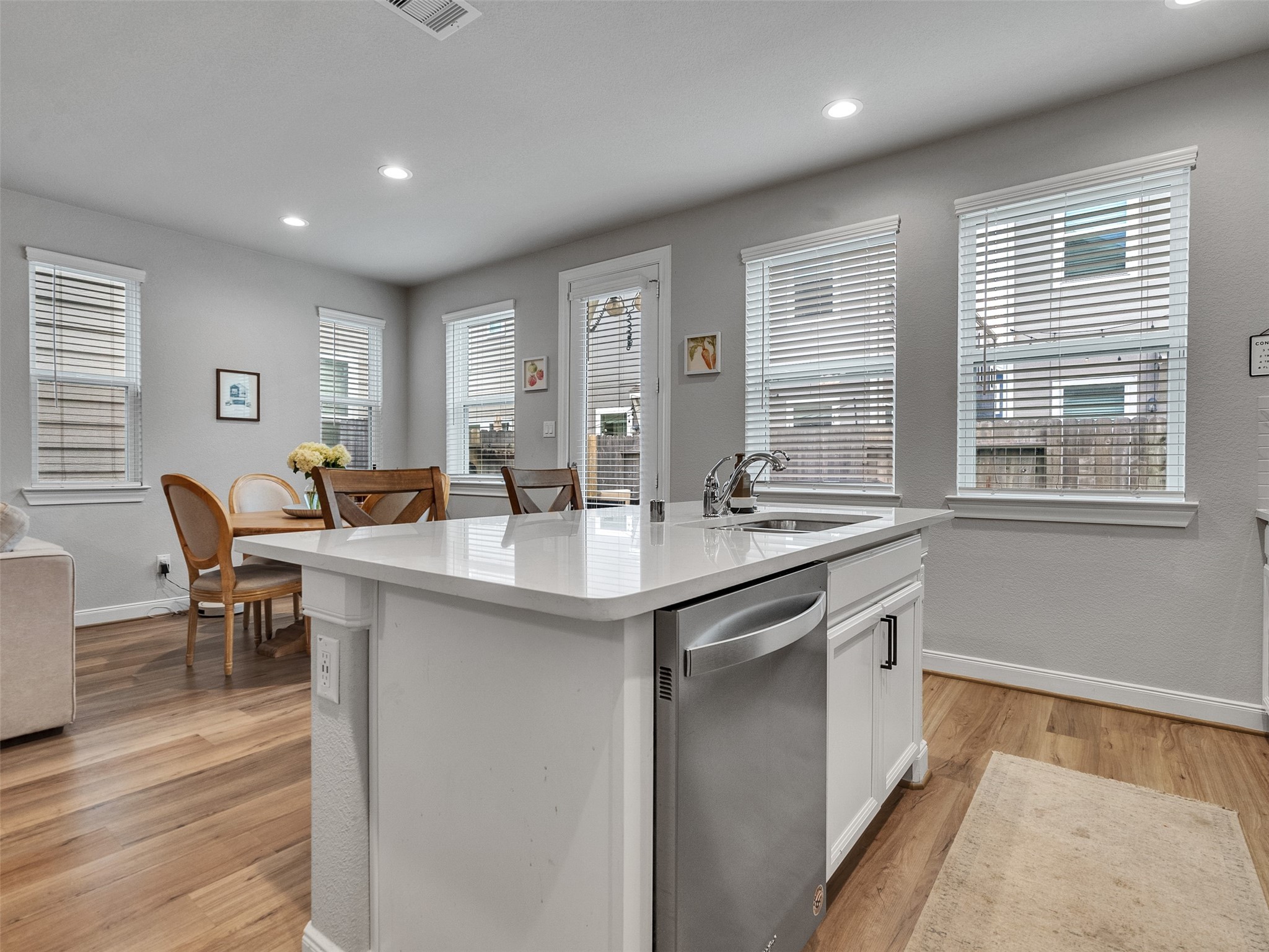 3118 Cloud Forest Lane Houston, TX 77080 - Photo 9 of 40 a kitchen with center island with sink and chairs