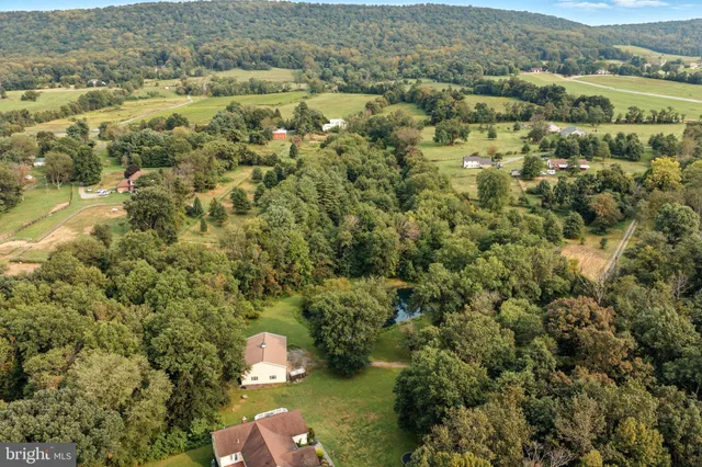 an aerial view of houses with yard