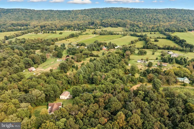 a view of a field with an ocean view