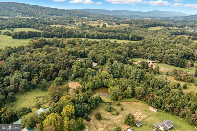 a view of a city with green field