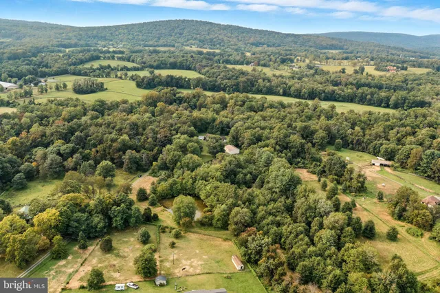 a view of a city with mountains in the background