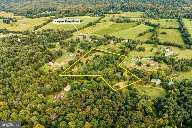 a view of a field with an outdoor space